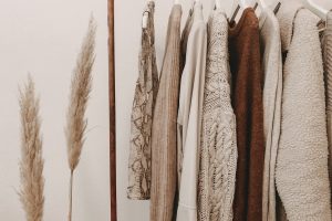 Curated vintage clothing rail featuring pre-loved designer silk and wool garments