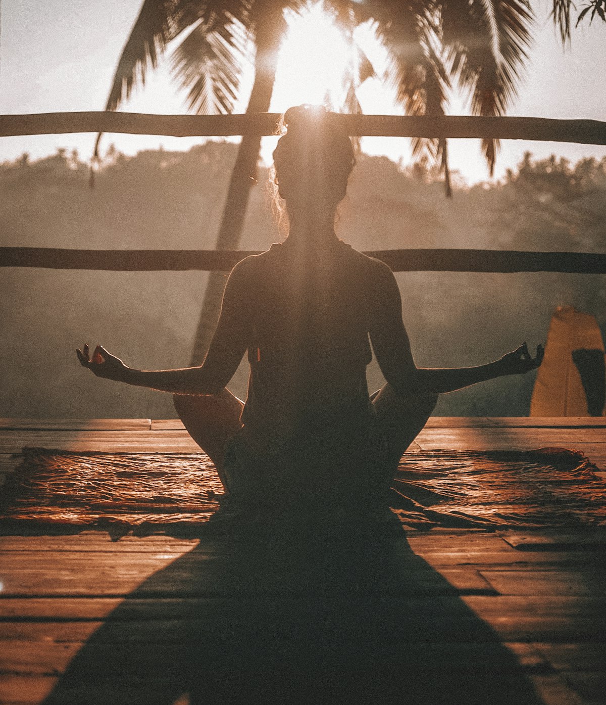 Peaceful morning meditation and yoga stretch routine in sunlit modern bedroom