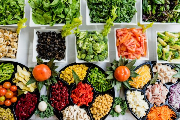 Vibrant organic superfoods, dark leafy greens, berries, and anti-inflammatory spices