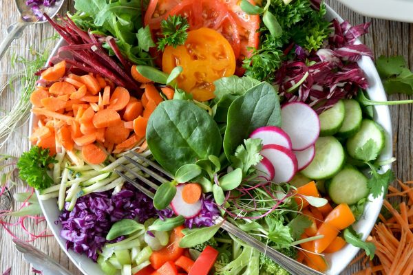 Nutrient-dense raw vegetable salad with fermented kraut and probiotic rich foods